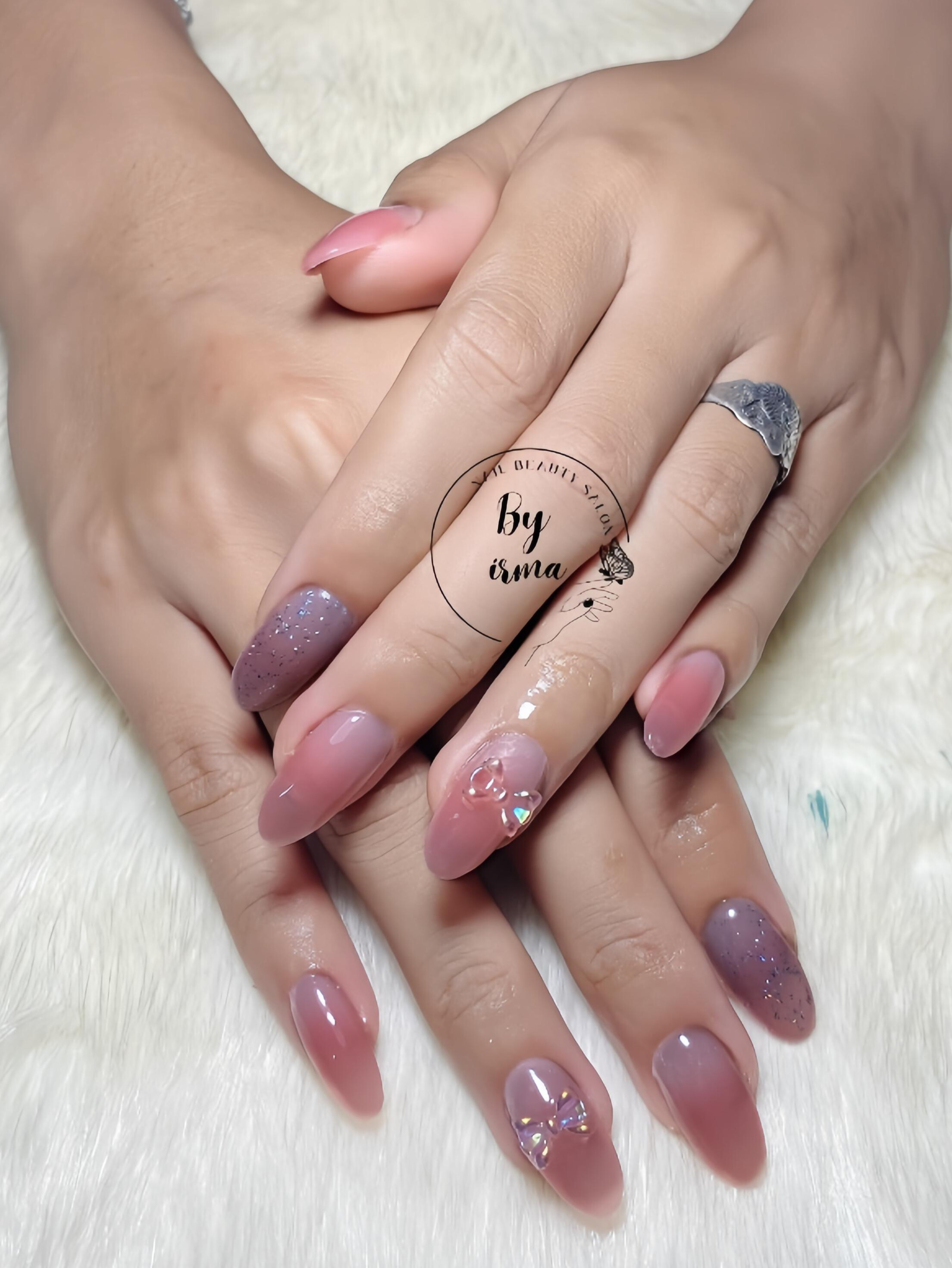 Stiletto nails with geometric black and white designs